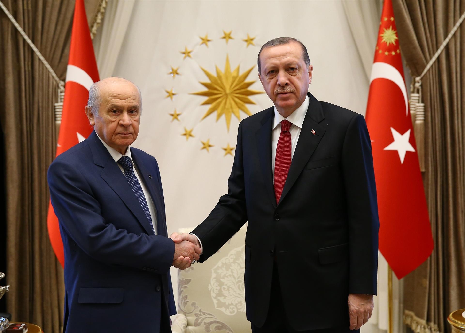 Bahceli and Erdogan shakes hands in Ankara