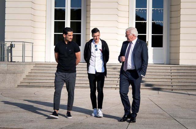 Germany's soccer stars Mesut Ozil and Ilkay Gundogan meet with German President Frank-Walter Steinmeier
