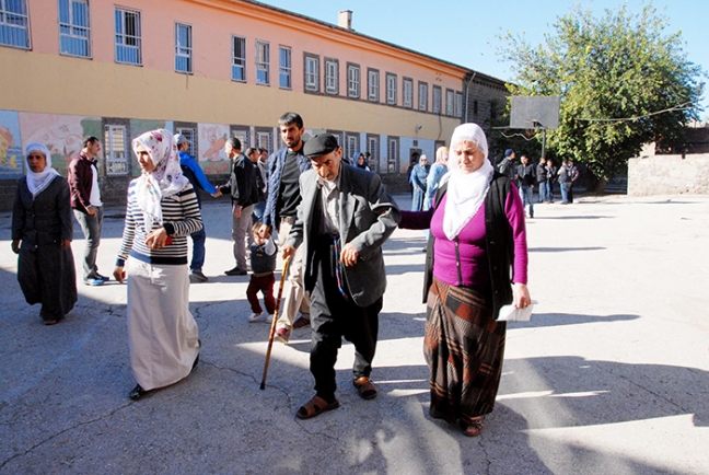 Kurdish people vote in a district in southeastern Turkey