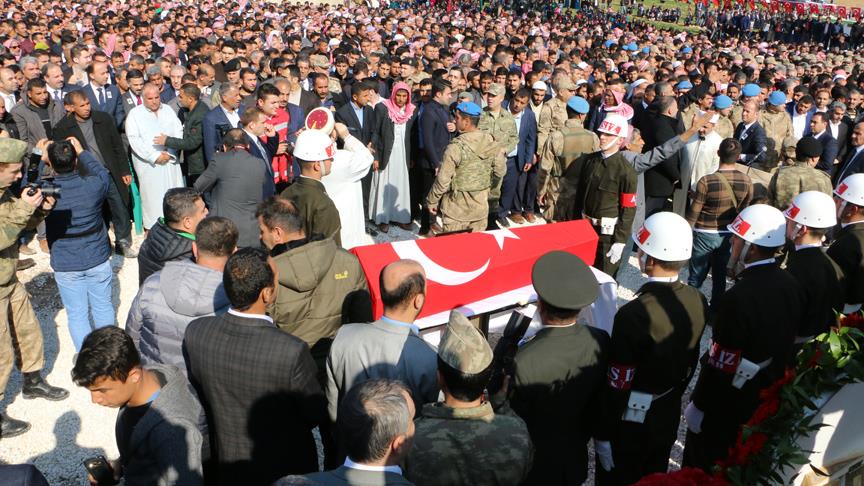 People attend a military funeral in Sanliurfa