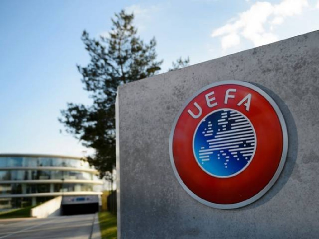 UEFA logo on a wall.