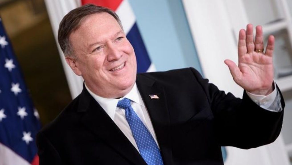 U.S. Secretary of State Mike Pompeo smiling at cameras.