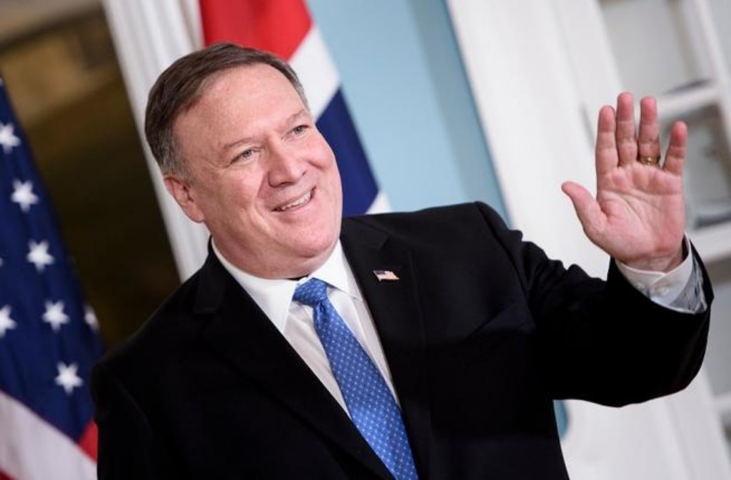 U.S. Secretary of State Mike Pompeo smiling at cameras.