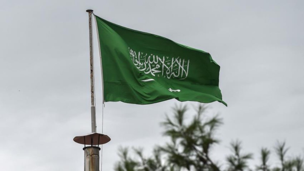 A Saudi flag is flying.