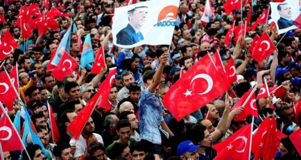 AK party supporters cheering on President Recep Tayyip Erdogan at a rally.