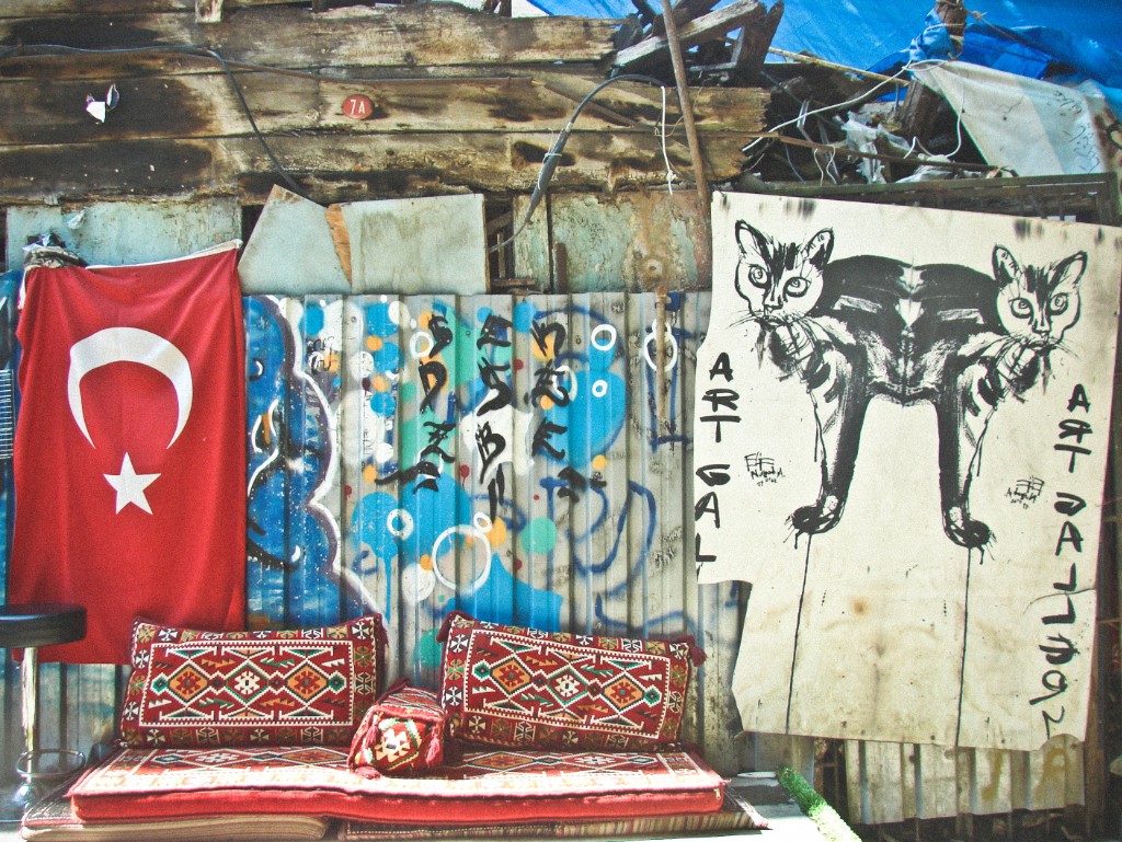Turkish flag next to street art.
